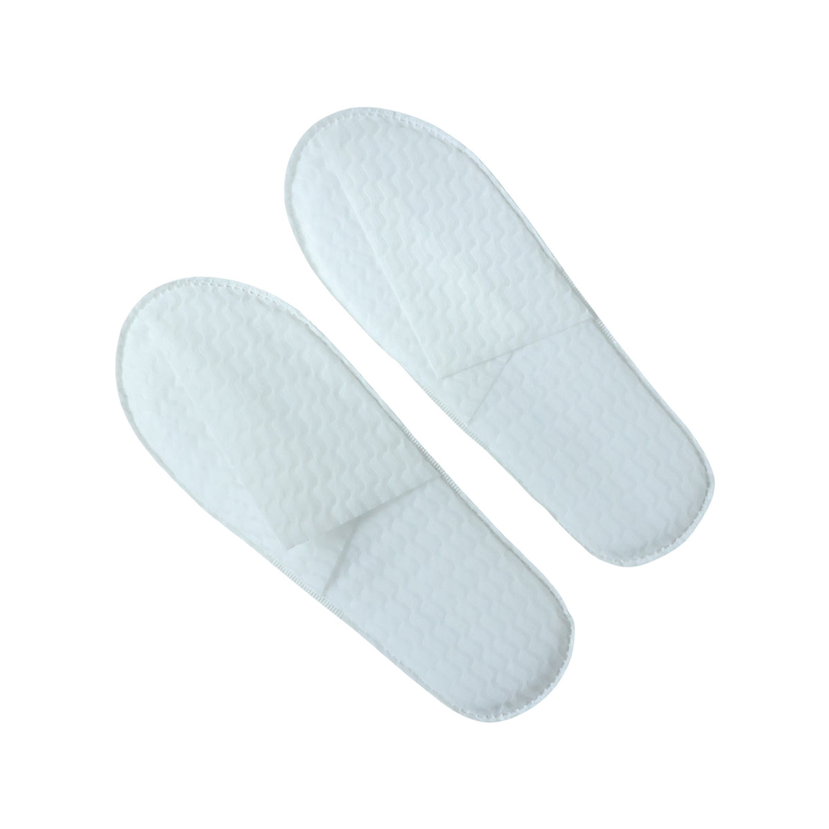 Pair of white disposable hotel slippers from Wukusy for guest comfort, shown in a clean, open pair ready for use.