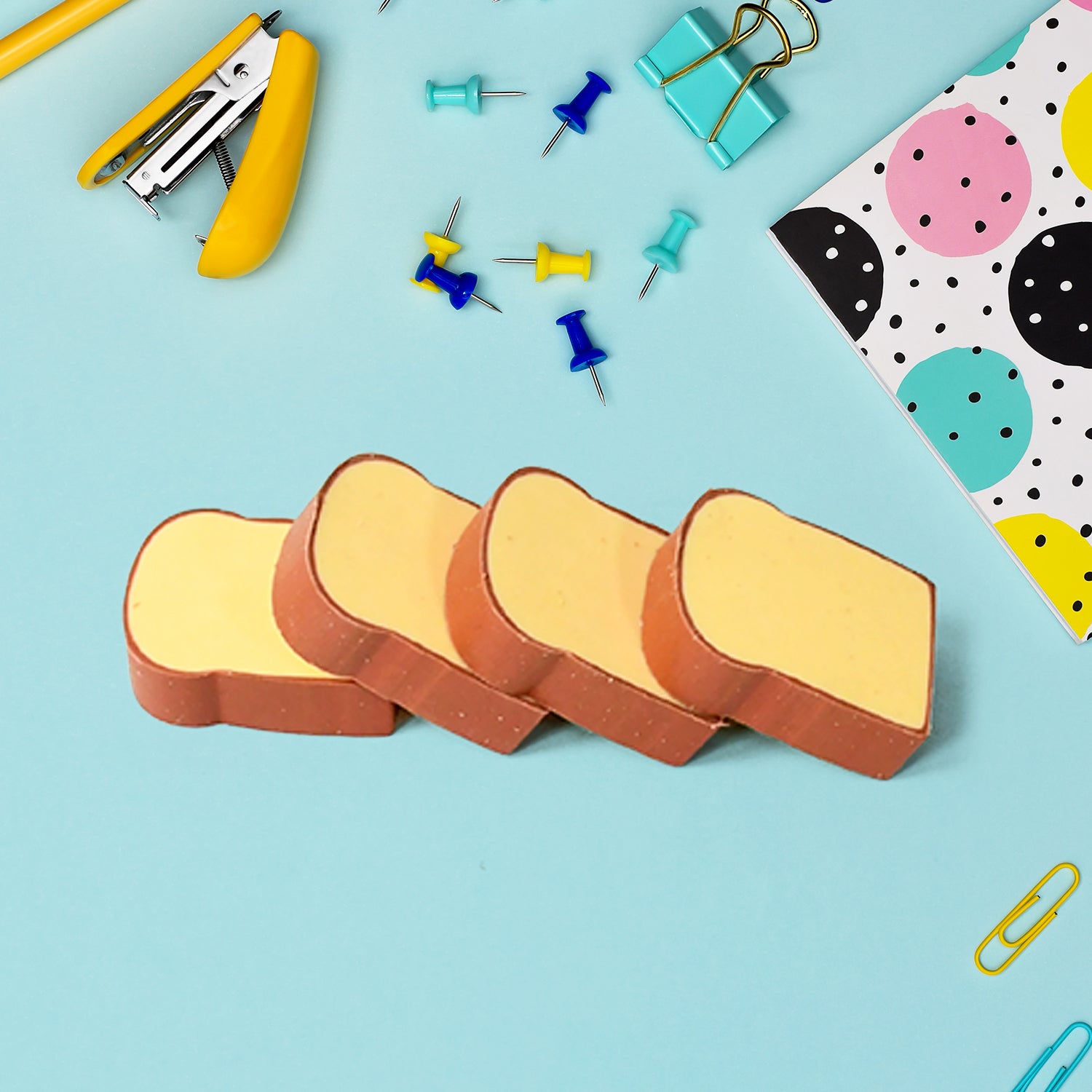 Set of four Wukusy 3D toast bread erasers shaped like bread, fun food-themed stationery for kids and students.