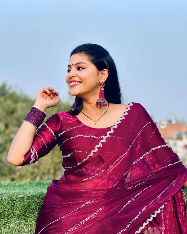 Elegant women's saree with intricate handwork from Jimmy Choo collection, showcasing detailed craftsmanship and luxurious fabric.