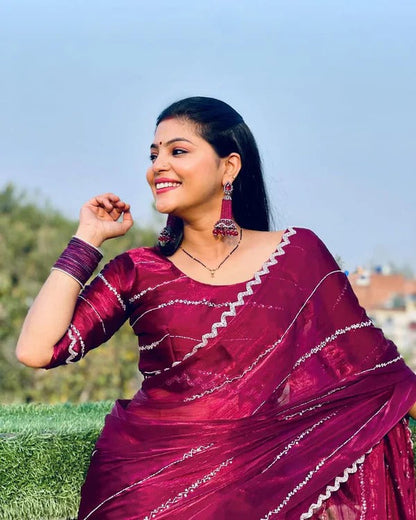Elegant women's saree with intricate handwork from Jimmy Choo collection, showcasing detailed craftsmanship and luxurious fabric.