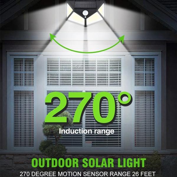 Wukusy 1255 solar garden lights with LED security lamps illuminating outdoor pathways and home exterior at night.