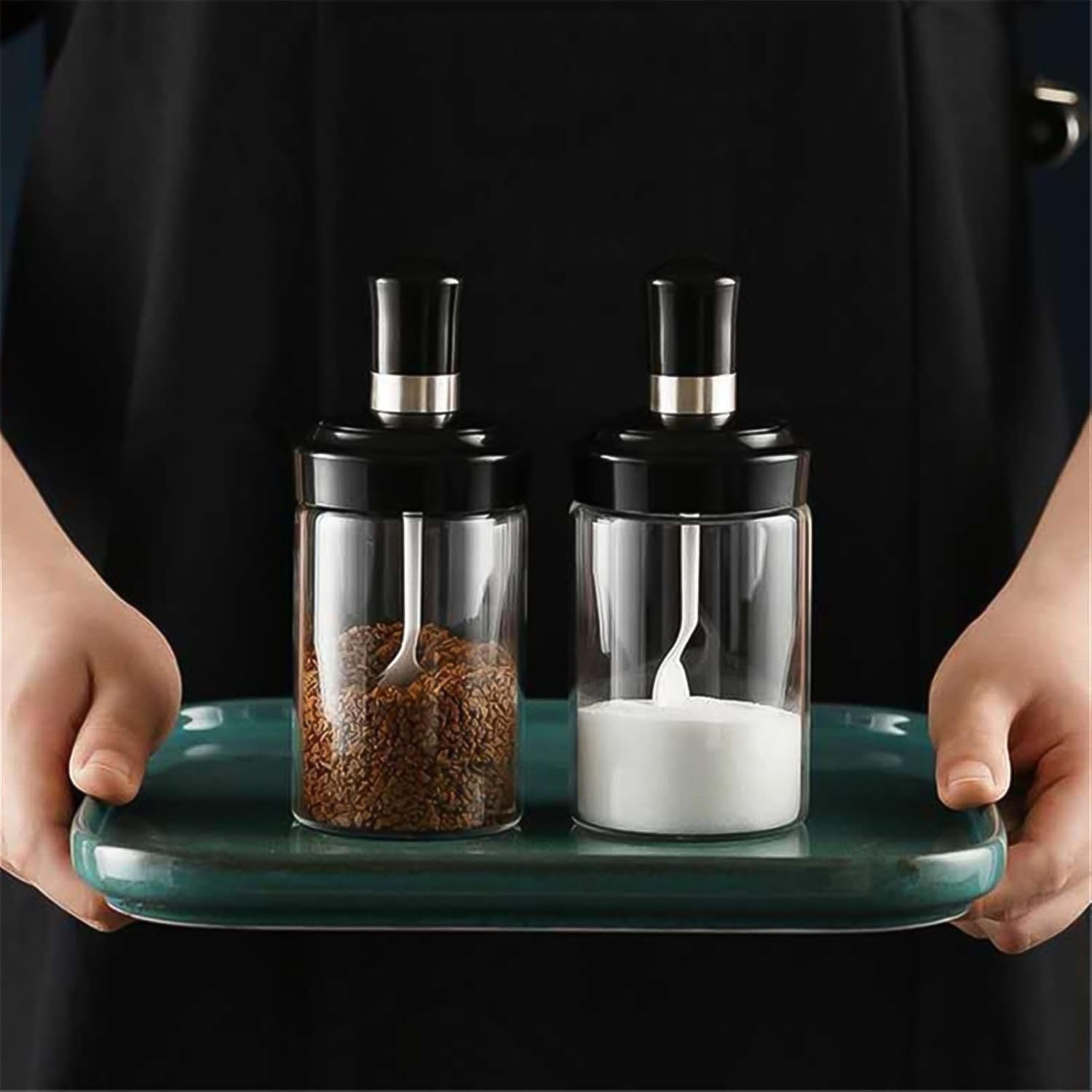 Transparent glass storage jar with built-in spoon, approximately 250ml, by Wukusy, ideal for kitchen organization and food storage.