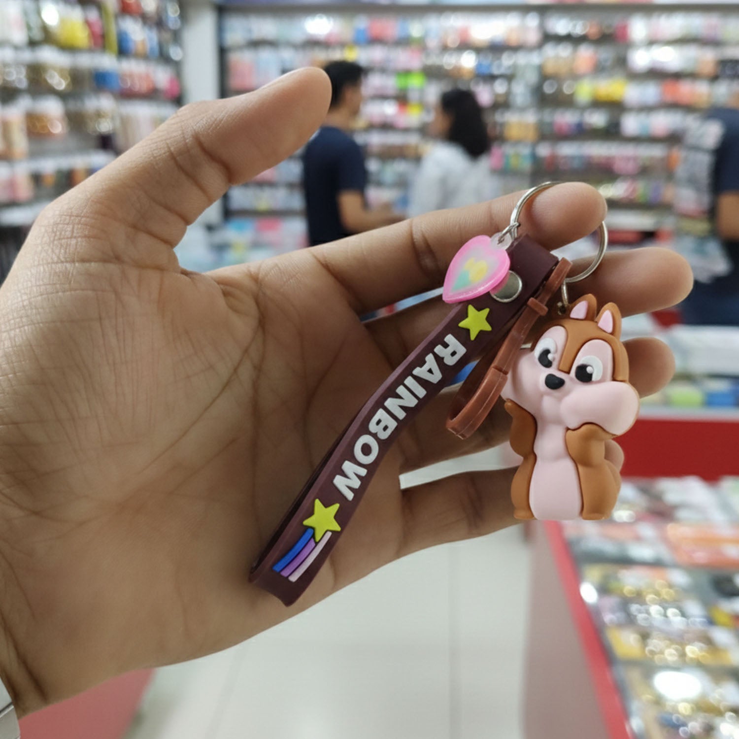 Cute cartoon animal silicone keychain with rainbow strap from Wukusy, featuring a colorful animal design on a bright strap.