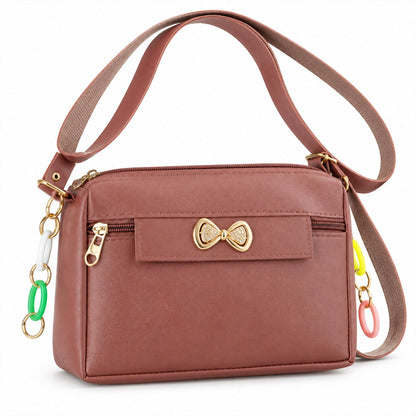Wukusy women's PU leather sling bag with adjustable strap and decorative bow, stylish compact crossbody accessory.
