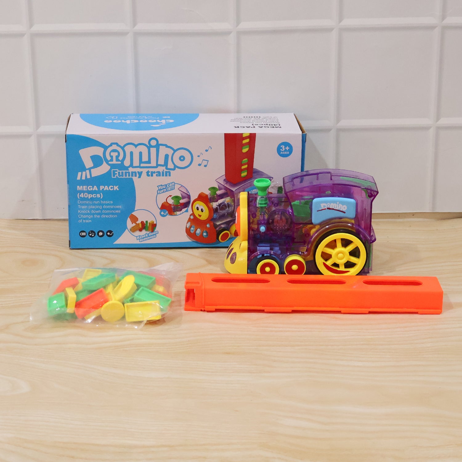 Wukusy automatic domino laying train engine toy for kids with lights and music, featuring colorful train and playful design