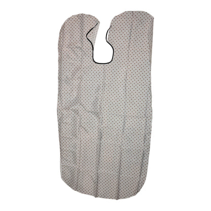 Wukusy professional barber hair cutting cape draped over a chair, lightweight and protective for salons or home haircuts.