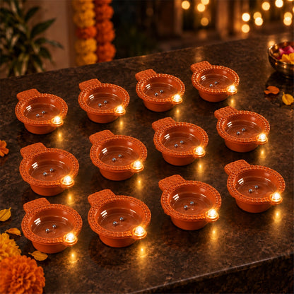 Set of 12 Wukusy flameless LED Diya water sensors for Diwali and Pooja decoration, with realistic diya-shaped lights and safe design.