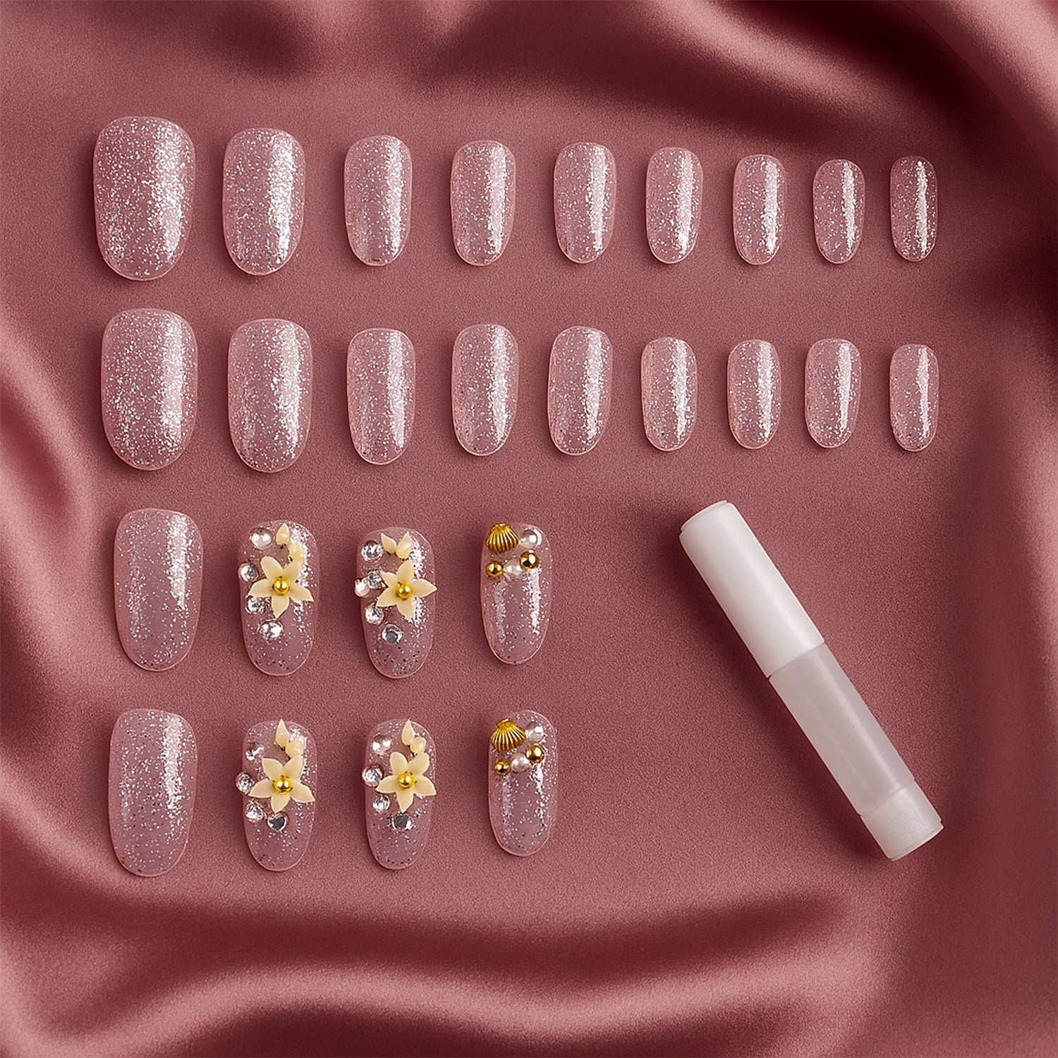 Wukusy premium glitter 3D floral press-on artificial nail tips with nail glue, featuring sparkling floral designs in a set