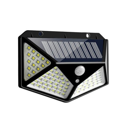 Wukusy 1255 solar garden LED security lamp illuminating outdoor pathways and home exterior at night