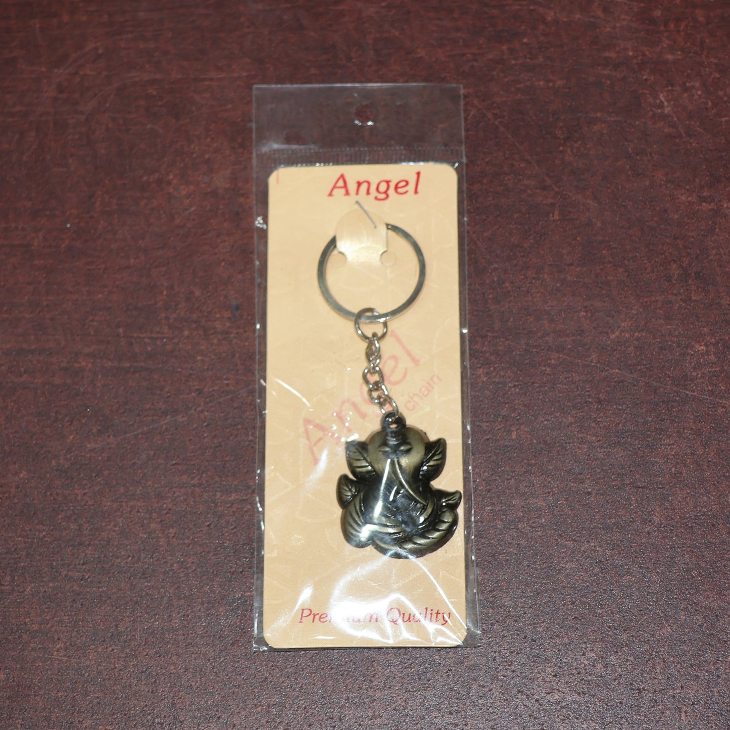 Antique black metal Ganesh face keychain from Wukusy, featuring intricate Indian deity design on a durable metal keyring.