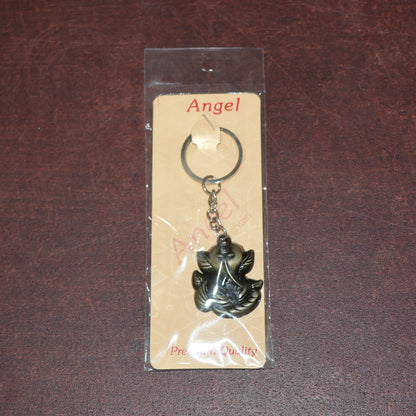 Antique black metal Ganesh face keychain from Wukusy, featuring intricate Indian deity design on a durable metal keyring.