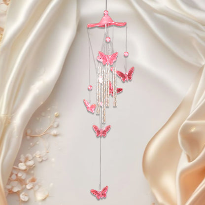 Wukusy Butterfly Bell Wind Chimes with colorful butterfly design hanging outdoors, creating gentle sound and decorative charm.