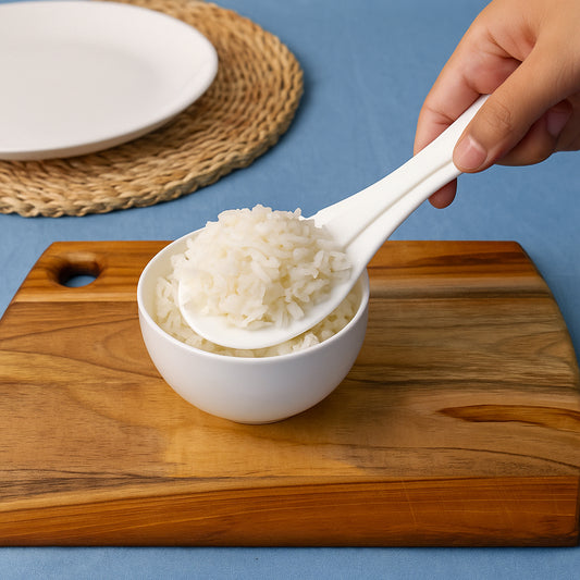 Wukusy plastic non-stick rice serving paddle with a curved handle and flat scoop, ideal for serving cooked rice.