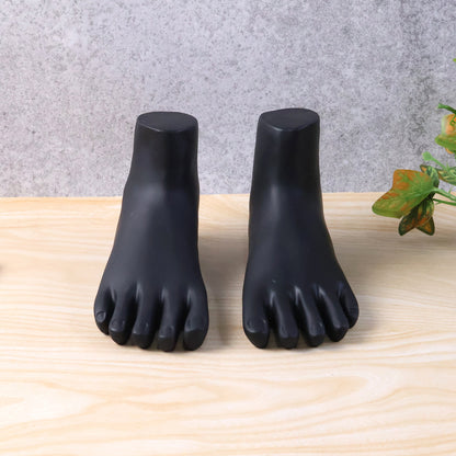 Pair of black foot mannequin display stands by Wukusy, showcasing realistic foot models for retail or photography displays.