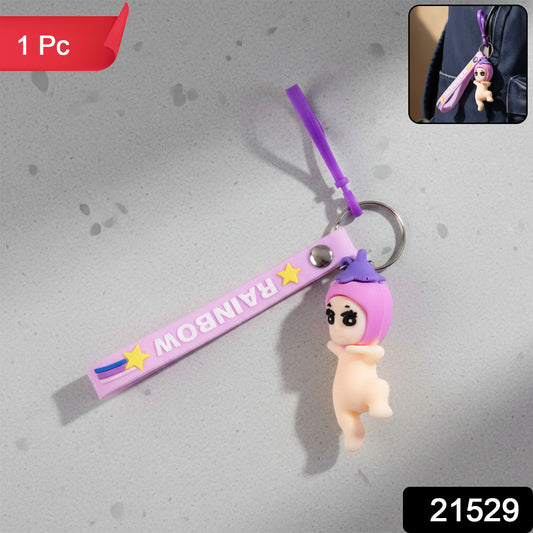Cute Wukusy baby doll cartoon silicone keychain hanging from a keyring, colorful and playful accessory for keys or bags.