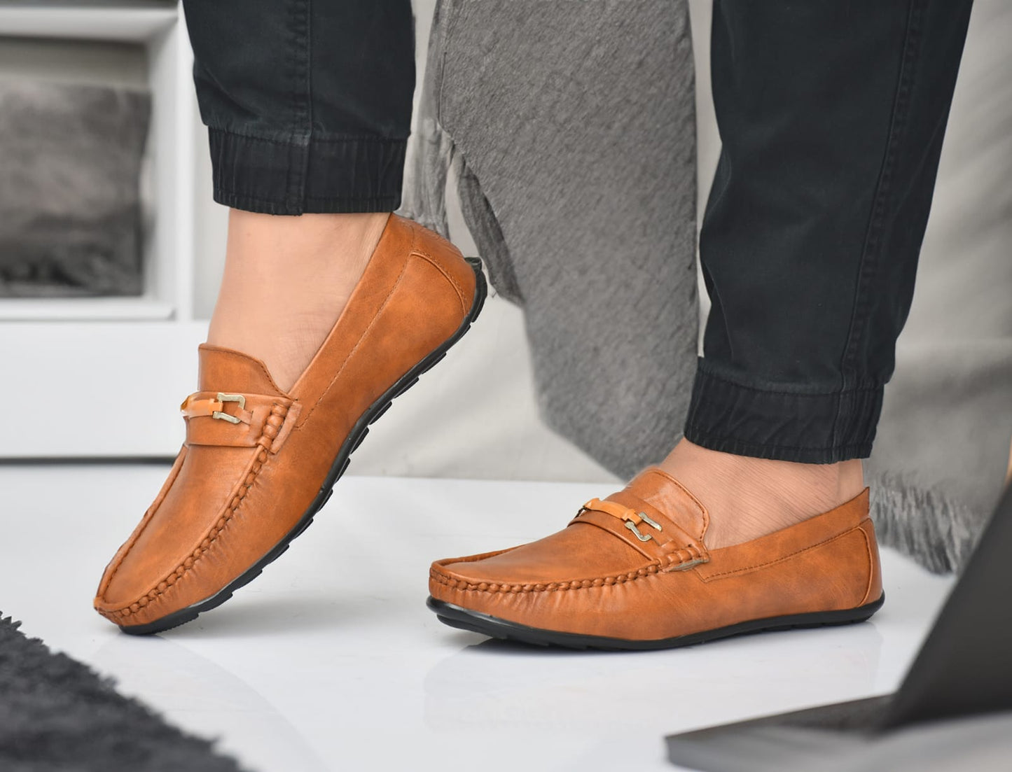 Leather men's loafer shoes from Drpshippr's collection, featuring classic slip-on design and stylish detailing.