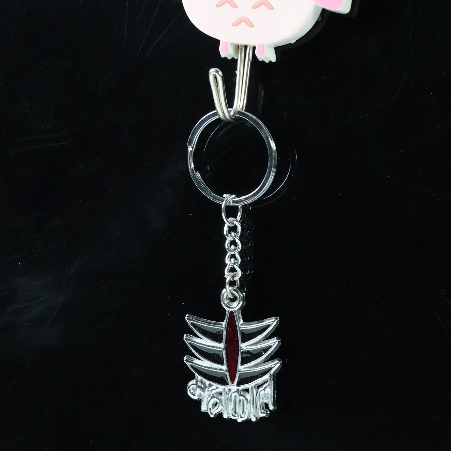 Wukusy Mahakal symbol metal keychain featuring intricate design, compact and durable for everyday use.