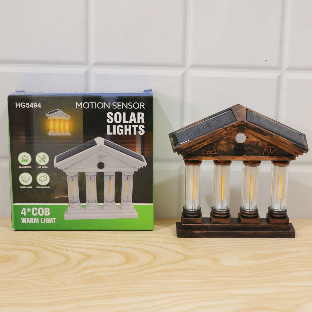 Wukusy 4 Cob Motion Sensor Solar Wall Light illuminating garden or porch with warm glow, outdoor security lighting.