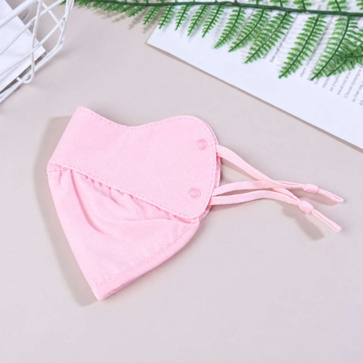 Reusable fabric face mask with adjustable ear loops by Wukusy, suitable for daily wear, shown with black material and secure fit
