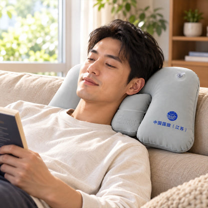 Wukusy inflatable travel neck pillow for flights and train trips, showing soft ergonomic design for seated rest.