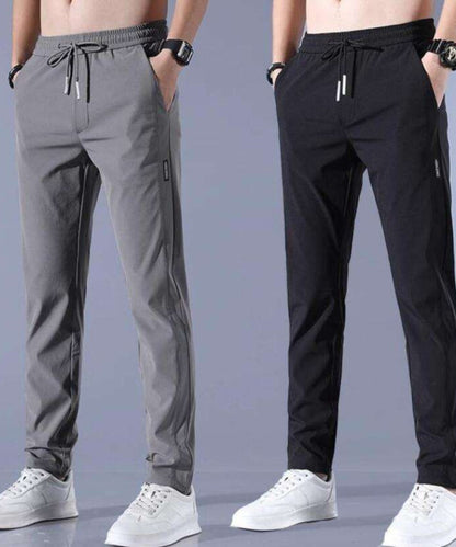 Pair of Dropdash men's straight track pants socks in black and gray, showing the fabric and elastic cuffs.