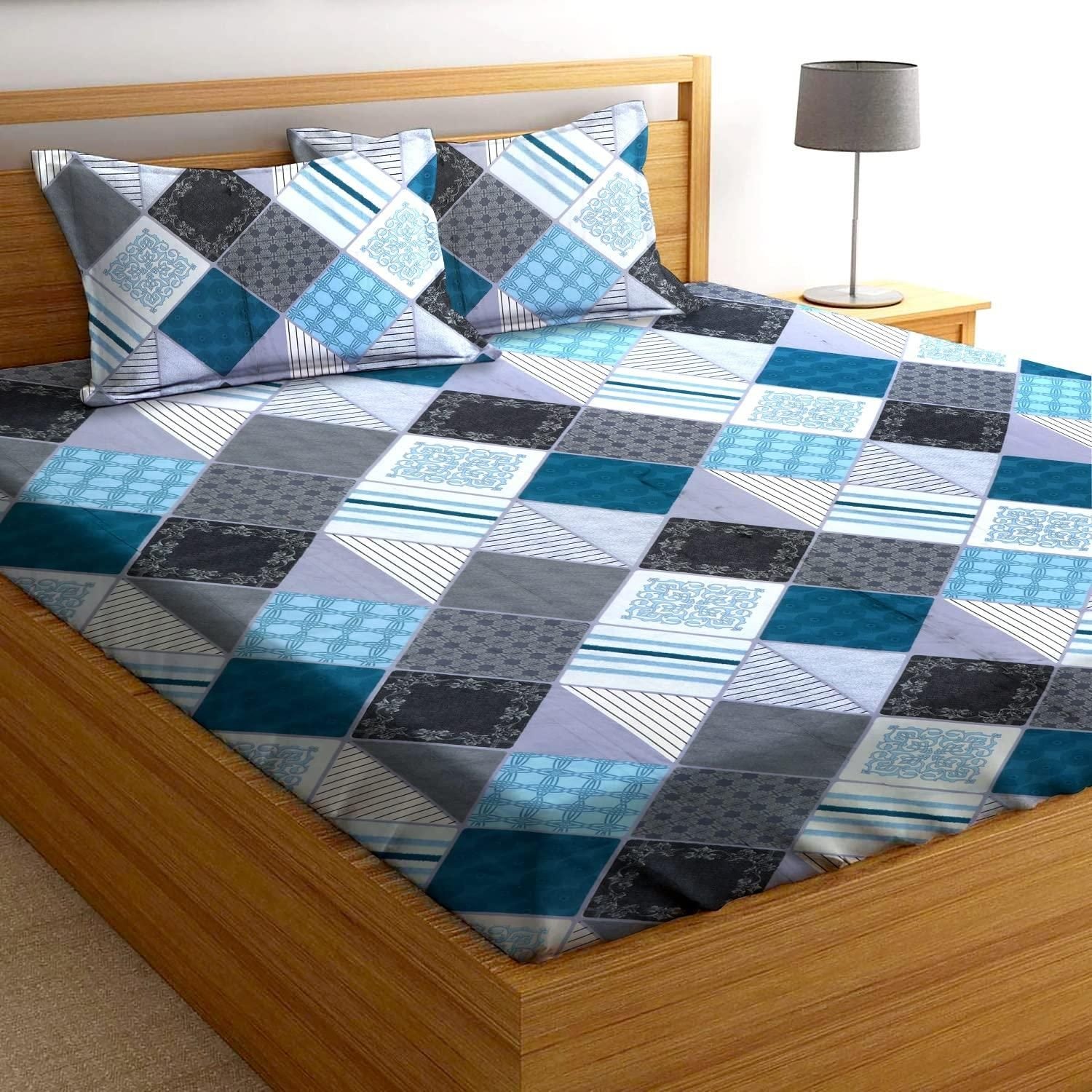 Microfiber elastic fitted double bedsheet by Drpshippr showing a neatly made bed with fitted sheet and elastic edges