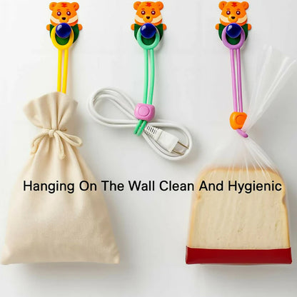 Set of three Wukusy reusable silicone food bag sealing clips with locking mechanism for secure kitchen storage.