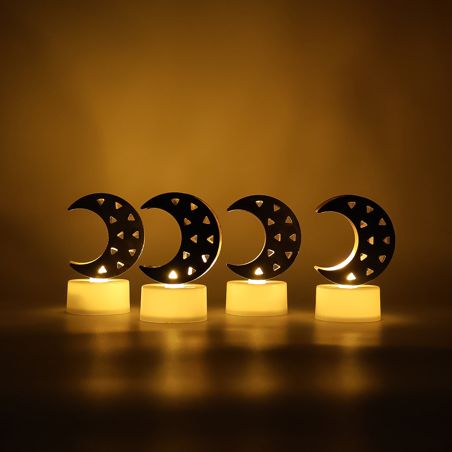 Set of four moon-shaped flameless LED candles by Wukusy, ideal for home decor with soft glowing light.