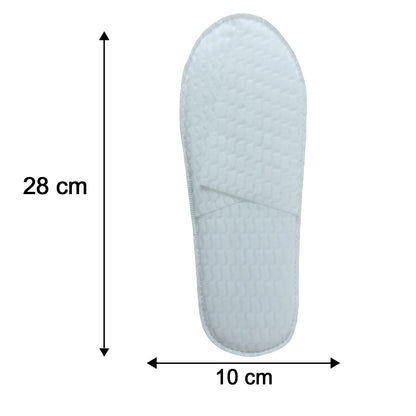 Pair of disposable hotel slippers by Wukusy, showing soft white fabric slippers with non-slip soles for guest comfort.