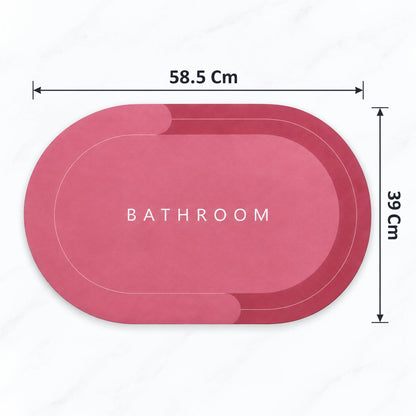 Two-tone oval bathroom rug by Wukusy, water-absorbing anti-skid bath mat in beige and white, 58.5x39 cm, on bathroom floor.
