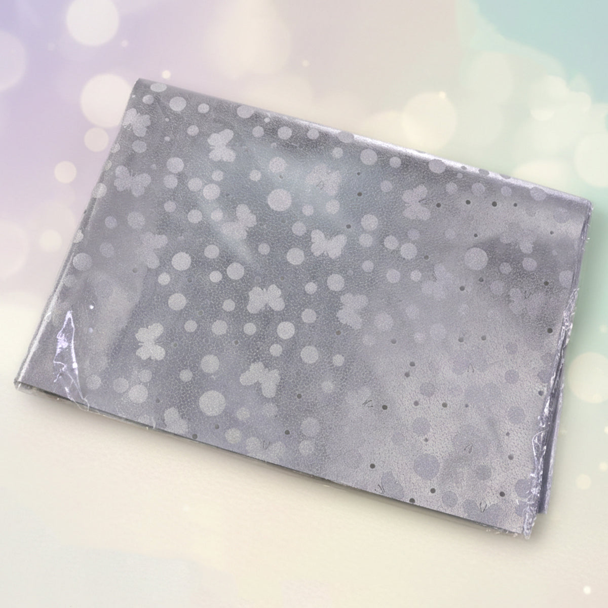 Silver decorative gift wrapping paper sheets from Wukusy, featuring a shiny, elegant design in a pack of approximately 20 sheets.