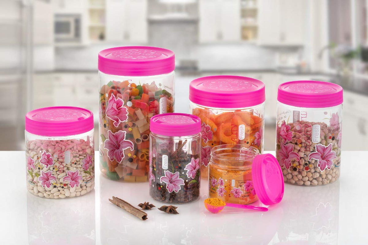 Set of six Drpshippr plastic airtight storage containers with printed design and spoons, in various capacities, pink color.