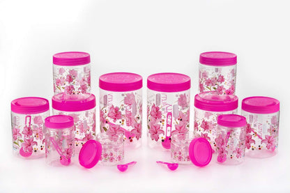 Set of six pink plastic airtight containers with printed designs and spoons, in 250ml, 350ml, 650ml, and 1250ml capacities.