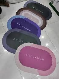Drpshippr premium silicon floor mat in bathroom with soft, super absorbent surface, ideal as a bath mat or doormat for pets.