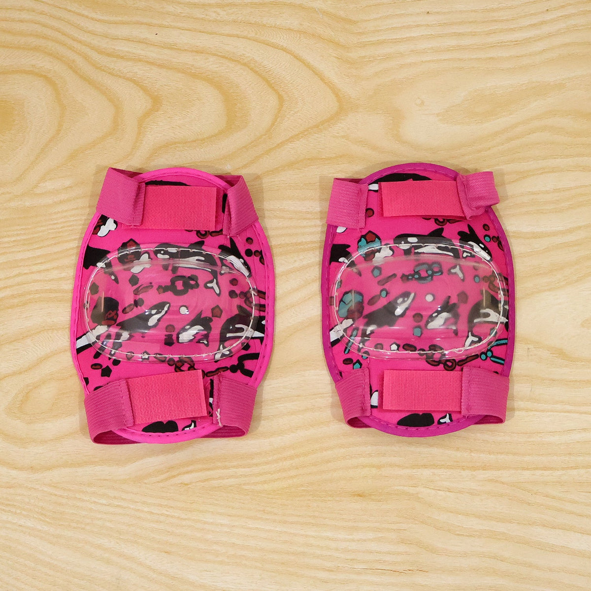 Wukusy adjustable kids knee protection pads for cycling, skating, and scooter play, showing padded knee guards for outdoor activity.