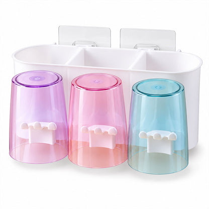 Wukusy wall-mounted toothbrush holder with three cups and bathroom storage, mounted on tiled bathroom wall.