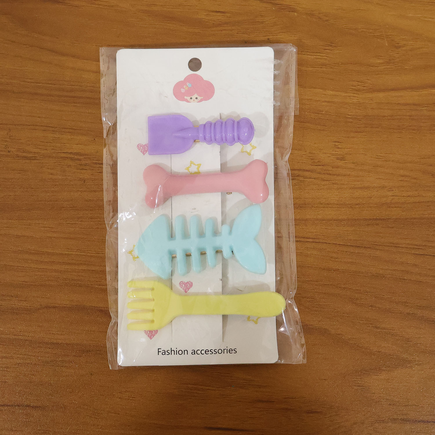 Set of four cute food shape hair clips by Wukusy, featuring colorful designs like sushi, cupcakes, and fruits.