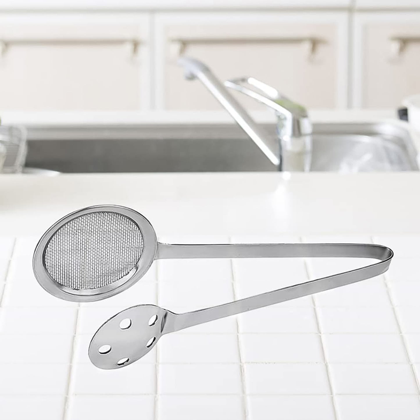 Wukusy Apex stainless steel skimmer serving tong with ergonomic handle for kitchen use, ideal for serving and straining food.