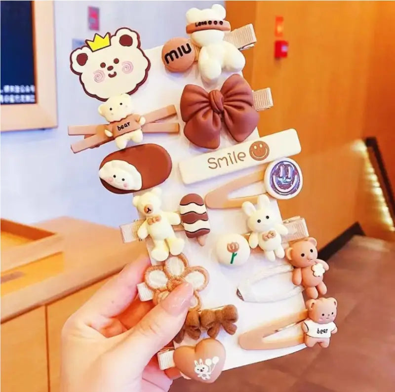 Ekom 14-piece set of small multicolor teddy bow hair clips with rubber grip, ideal for styling and securing hair.
