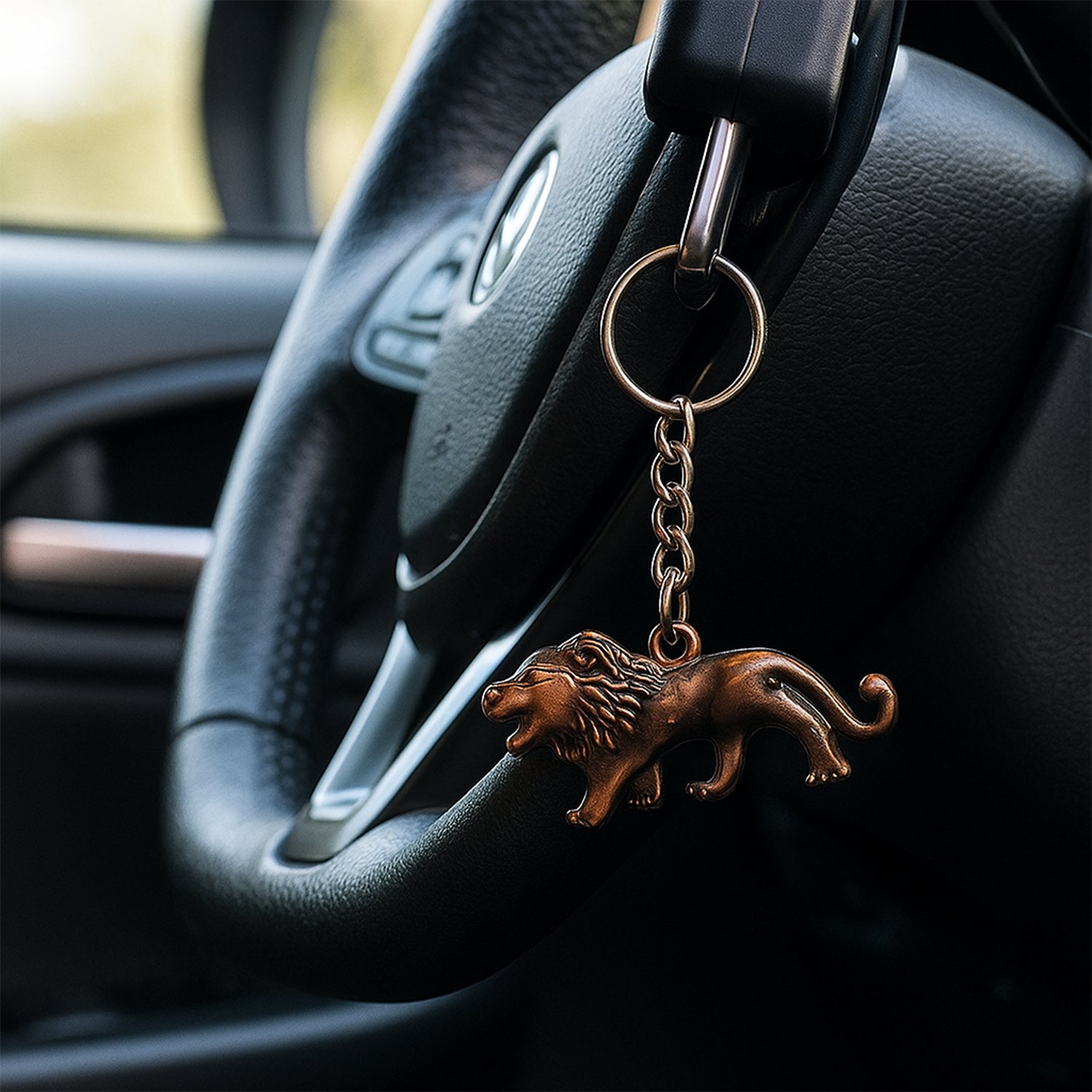 Metal keychain featuring an elegant walking lion design by Wukusy, showcasing detailed lion figure on a keyring.