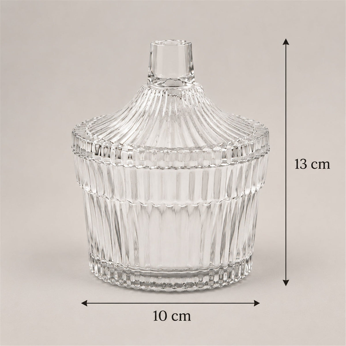 Wukusy crystal clear candy jar with lid, ribbed design, ideal for storing dry fruits and sweets, transparent and decorative.