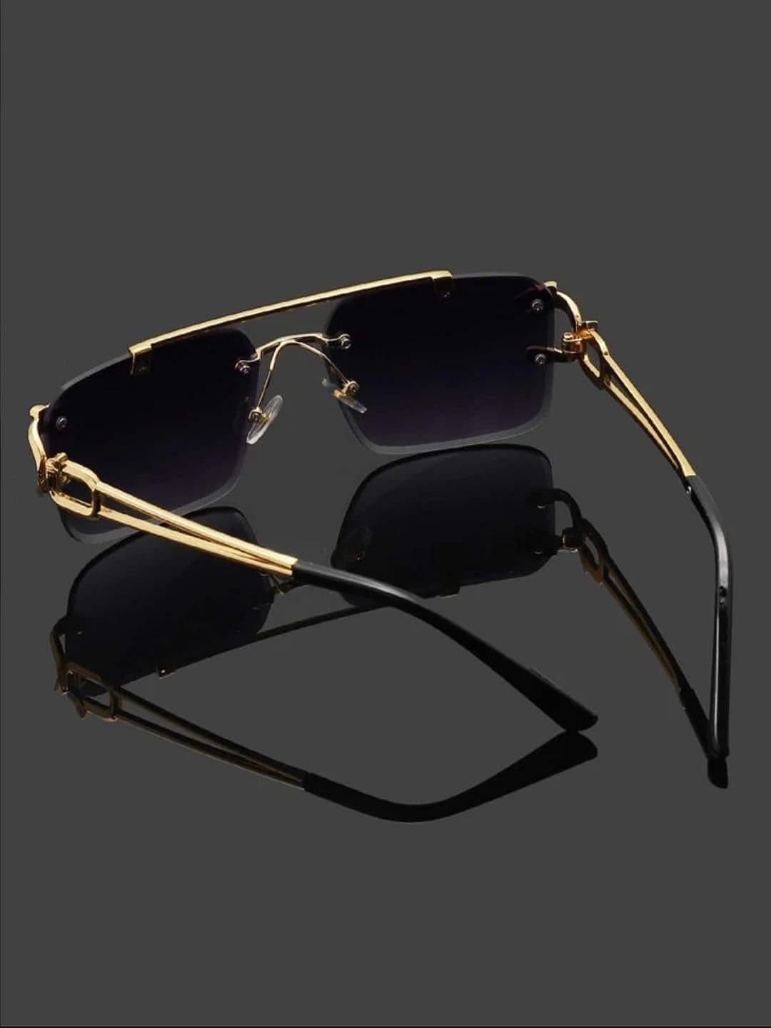Golden rimless sunglasses with black gradient lenses, stylish eyewear from the men's collection.