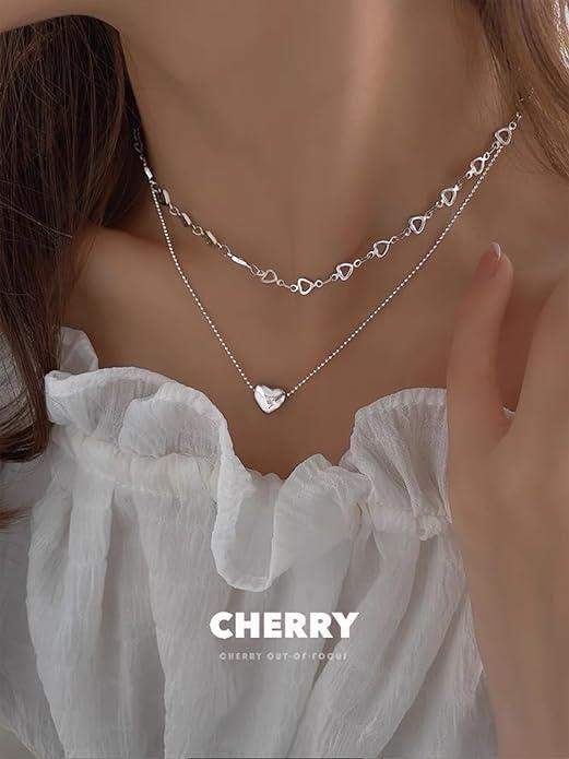 Silver Salty Falling In Love necklace by Drpshippr featuring a delicate chain with a charming pendant.
