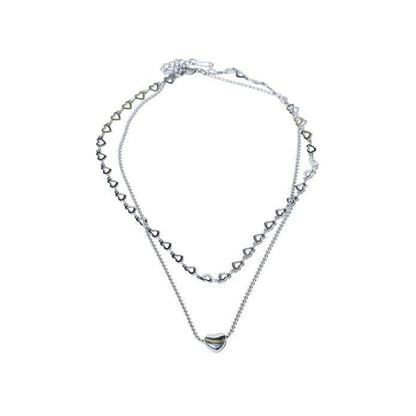 Silver necklace with Salty Falling In Love pendant, stylish jewelry by Drpshippr, displayed on a neutral background.