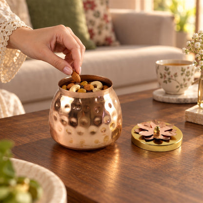 Copper finish storage jar with flower lid for dry fruits and home decor, featuring a decorative floral design and sleek metallic surface.