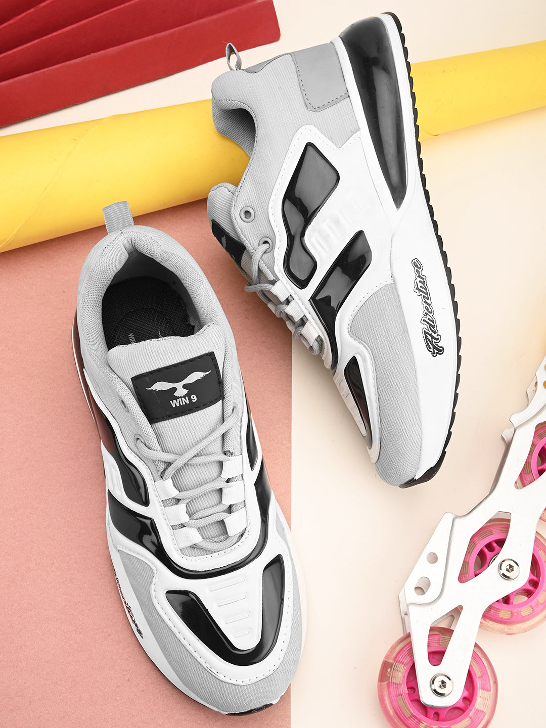 Athletic sports shoes by Drpshippr in black and white with cushioned soles and breathable mesh uppers for outdoor activities.