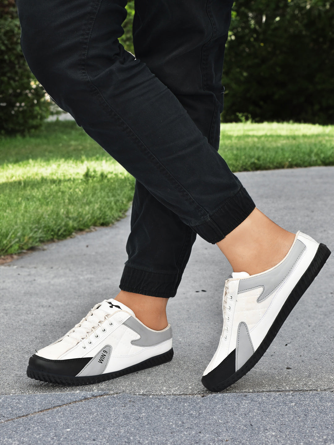 Pair of Drpshippr sports shoes designed for outdoor activities, featuring breathable material and athletic sole for comfort and performance.