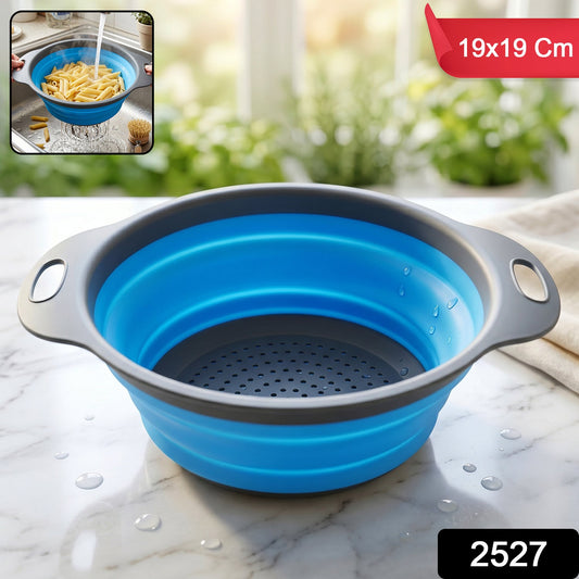 Foldable silicone kitchen strainer with handles, space-saving drainer by Wukusy, shown folded and in use for draining vegetables.