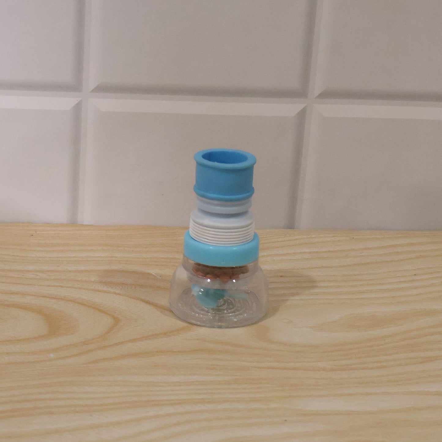 Wukusy plastic faucet water filter aerator attached to kitchen sink tap, splash-free design for improved water flow.