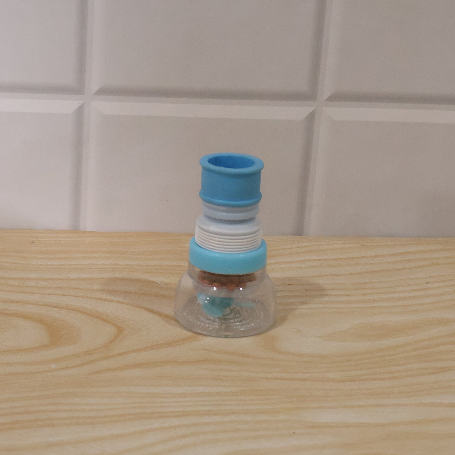 Wukusy plastic faucet water filter aerator attached to kitchen sink tap, splash-free design for improved water flow.